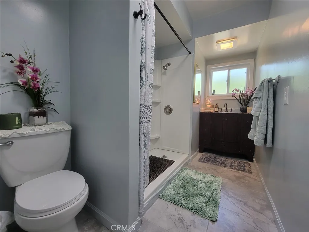 Another bathroom with big walk in shower