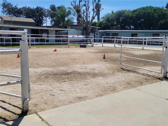 Arena with stables in backgroung