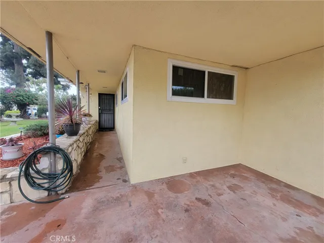 Huge covered porch leads to utility room