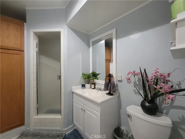 Hallway bathroom with stall shower