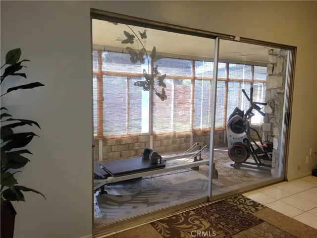 Multiple sliding glass doors to the patio