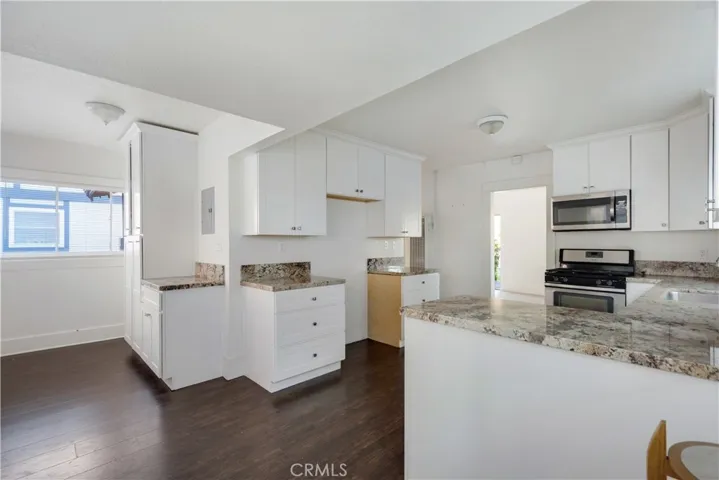 Front, single level unit has it's on private yard and has been tastefully upgraded and remodeled