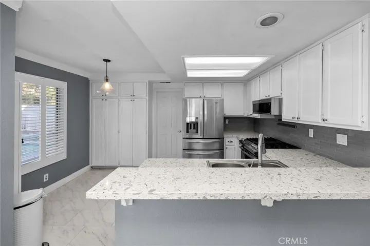 Kitchen with breakfast bar.