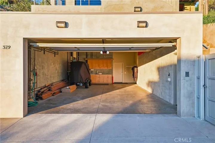 Oversize garage for cars. Tenant Closet is filled with wetsuits, surfboards, bodyboards, beach chairs, umbrella, etc.  (Golf Cart not included with lease)