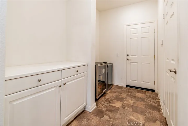 Kitchen cabinets (L) and pantry on the right