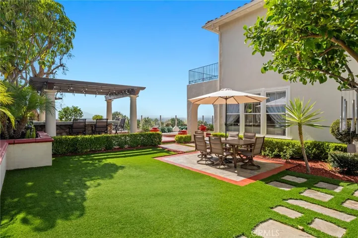 Set on a tranquil cul-de-sac with approximately 9,322 square feet of private grounds, the property offers a rare opportunity to enjoy sophisticated resort-style living.