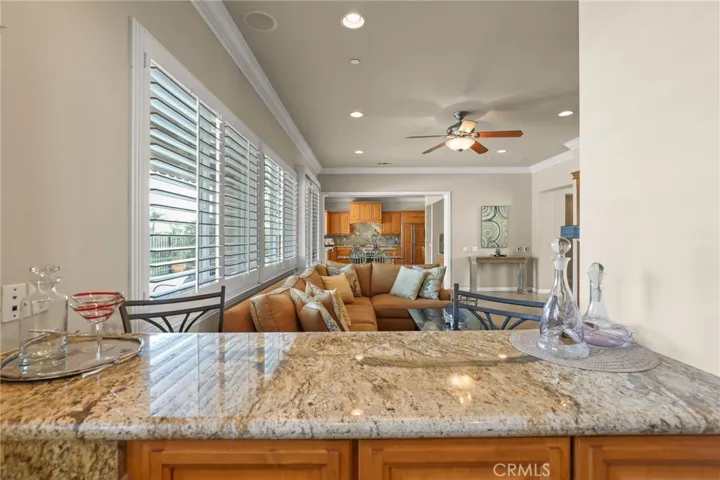 Wet bar overlooks family room and close to pool