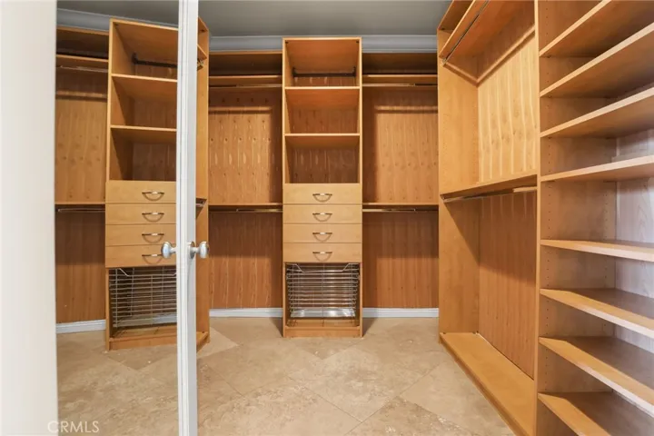 Two walk in closets in primary bedroom