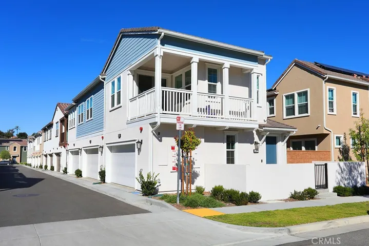 Alternate exterior angle showcasing corner location, architectural details, and neighborhood setting.