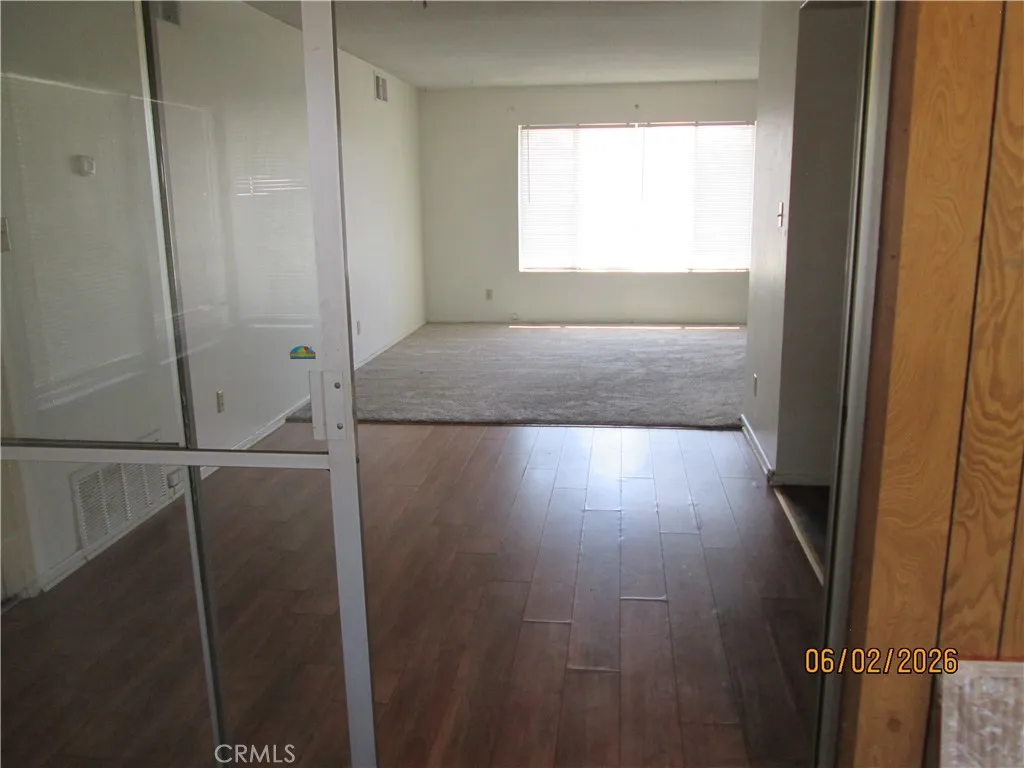 VIEW FROM ENCLOSED PATIO TO DINING ROOM