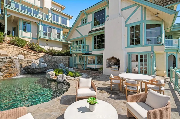 The poolside guest quarters feature ocean views, a fireplace, and an ensuite bath.