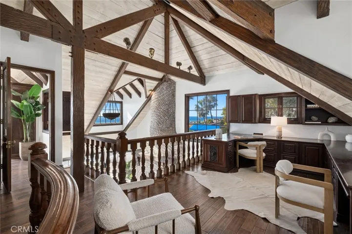 Additional highlights include a loft-style office, expansive family room, and two main-level guest rooms.