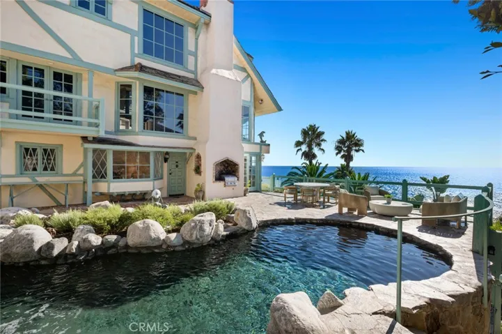 Perched above the Pacific Ocean, this rare Laguna Beach estate unfolds across more than half an acre, offering direct beach access with rare ownership of a portion of the sand, panoramic coastal views, and resort-style amenities.