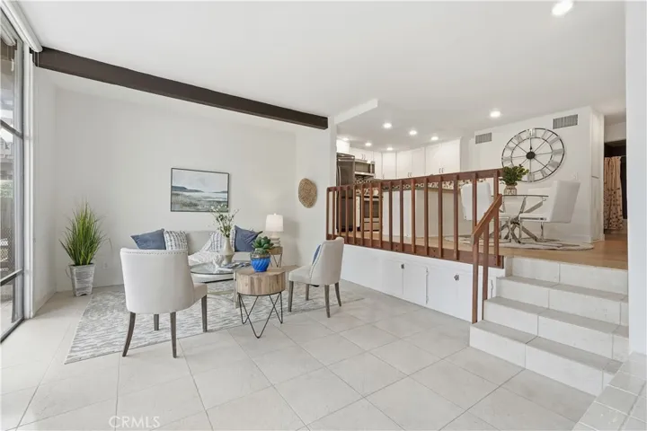 Spacious living room with floor to ceiling windows, fireplace & private waterfront balcony!