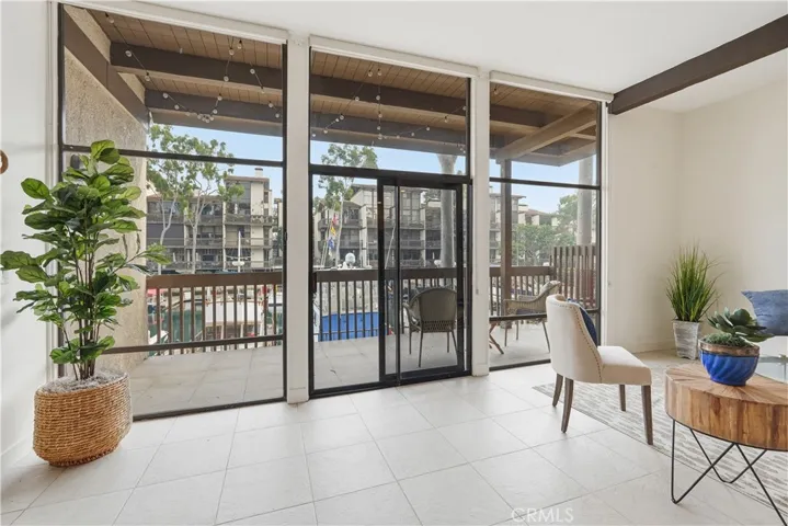 Spacious living room with floor to ceiling windows, fireplace & private waterfront balcony!