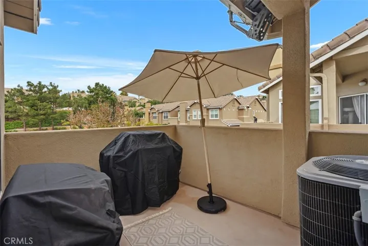 Private balcony with plenty of room for entertaing and two BBQ's!  Newer  energy-efficient HVAC system adds huge value!!!