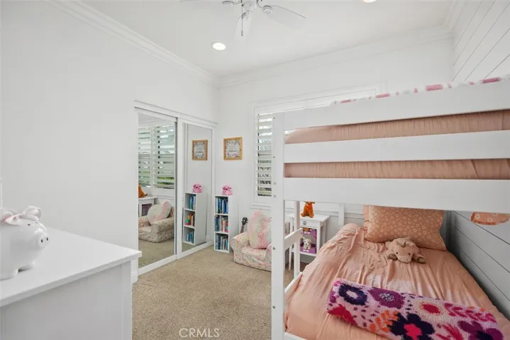 Secondary bedroom with new closet dpors and organization system!