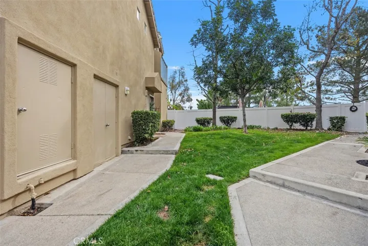 The exterior view of the end-unit grass area.