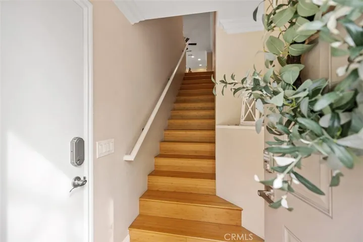 The Private interior stairway provided access to the toughtfully designed upper-level living spaces.