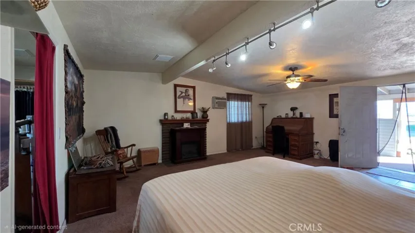 Large master with access to enclosed patio and backyard area