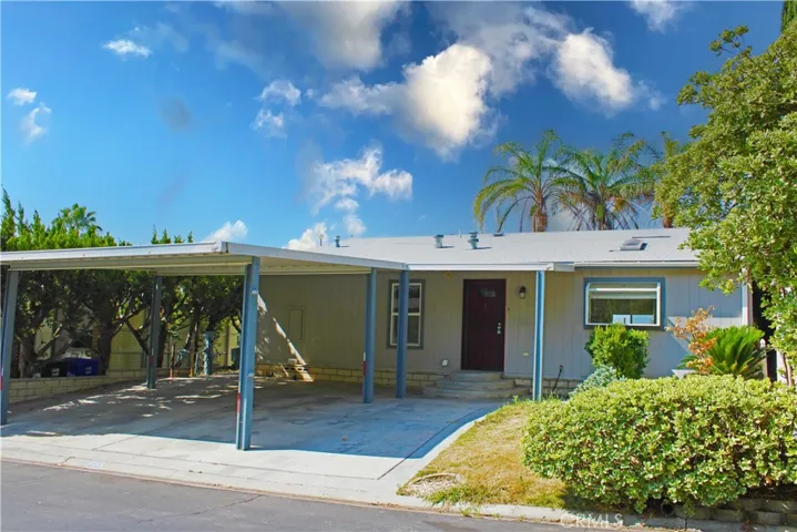 Front of home with side by side parking