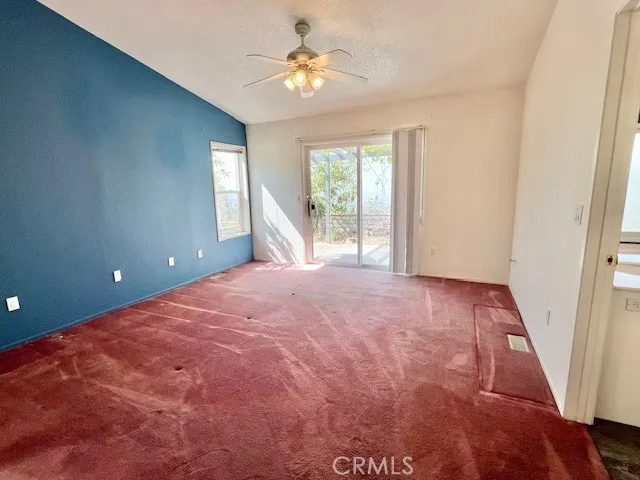 Original photo of primary bedroom