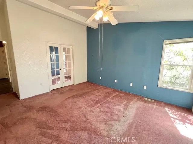 Primary bedroom and door to office