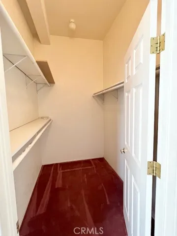 Primary bedroom walk-in closet
