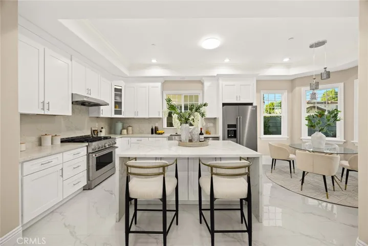 The center island and the breakfast area in Kitchen