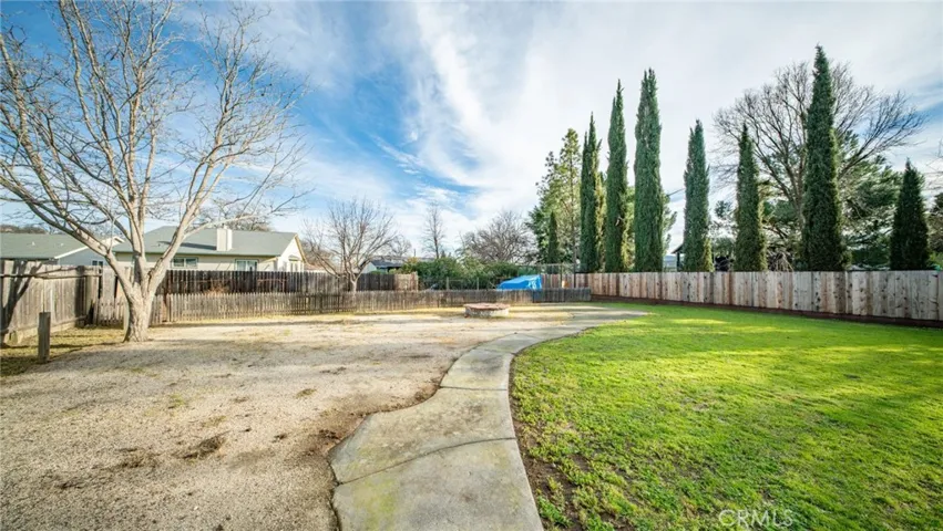 Backyard with gardening area in rear.