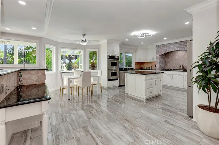 Work desk-breakfast nook-light & bright kitchen w/gorgeous tile flooring.