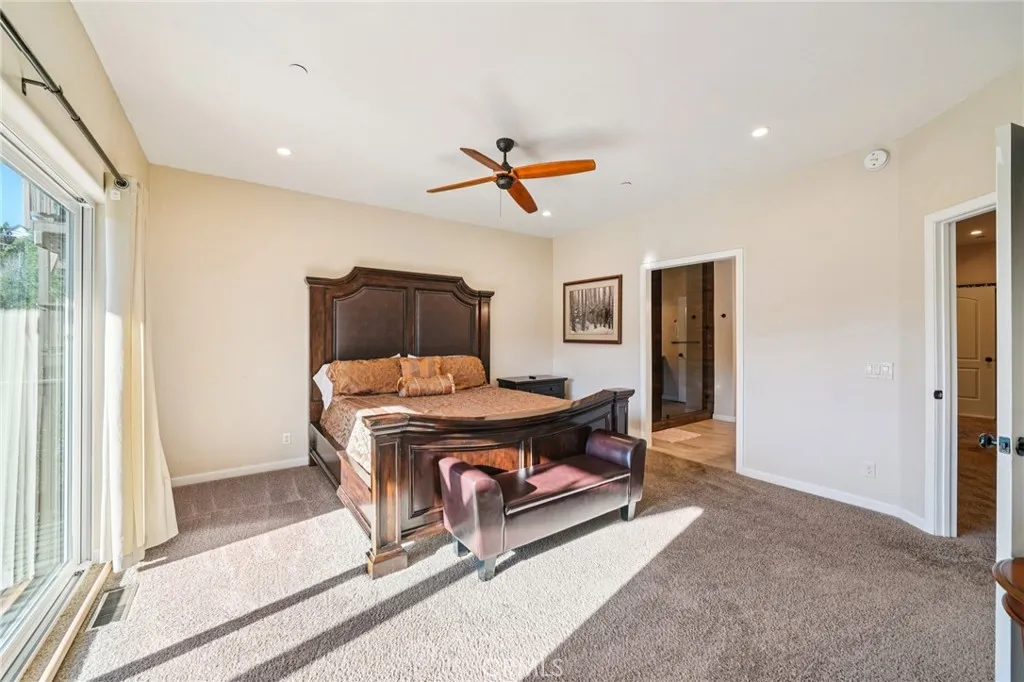 Generous layout with recessed lighting and direct ensuite access.