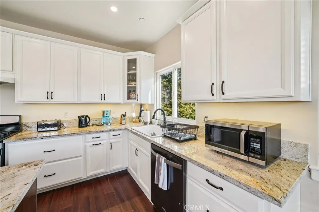 Long counters, window over the sink with treetop outlooks, and abundant cabinet storage.