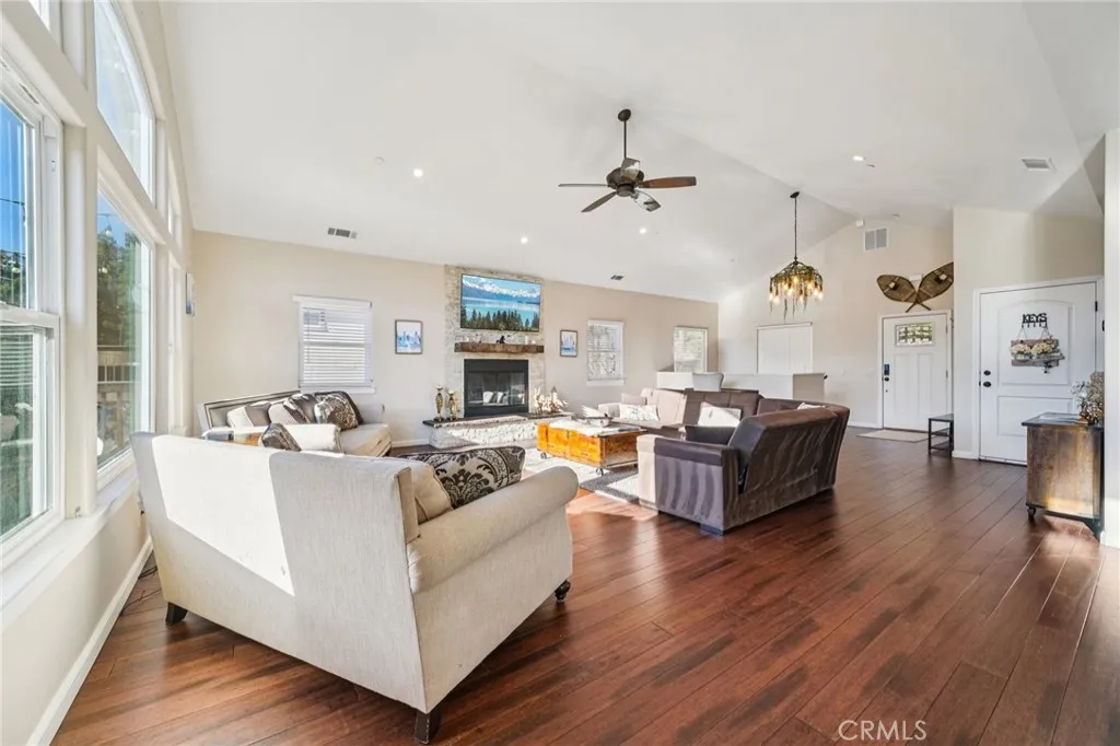 Bright, view-filled seating area flows seamlessly to the foyer and dining, enhancing circulation.