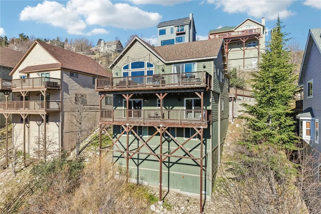 Three tiers of decks maximize forest views and outdoor living.