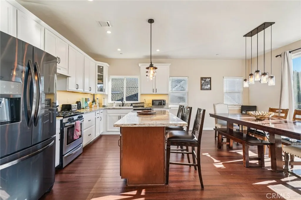 Stainless appliances, ample prep space, and island seating for casual meals.