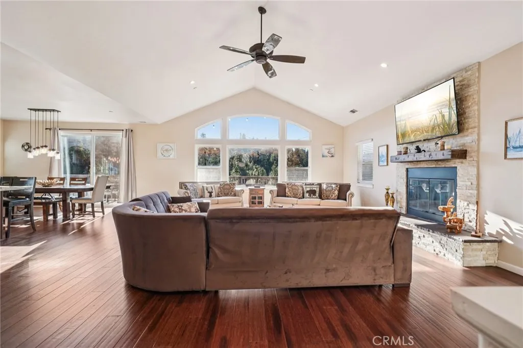 Wall of windows frames treetop views; clerestory arches amplify light and mountain ambience.