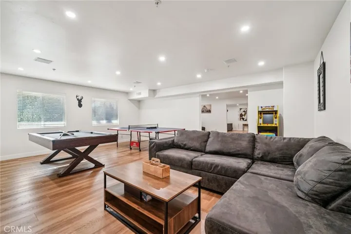 Bright media hangout with recessed lighting and space to spread out.