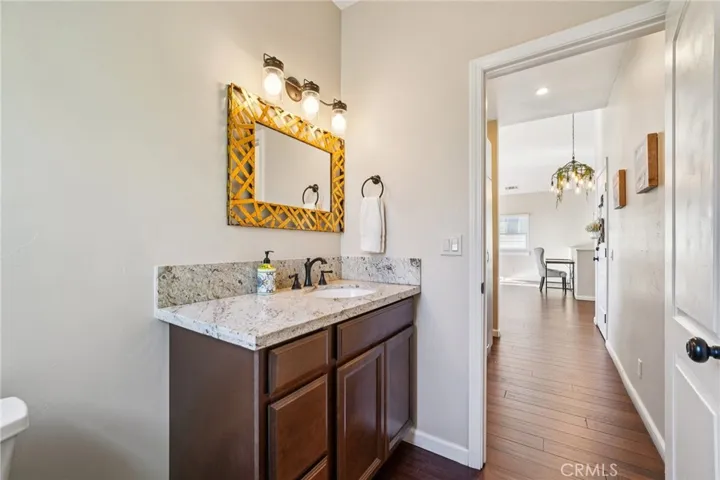 Stylish mirror and updated lighting; easy access for guests.