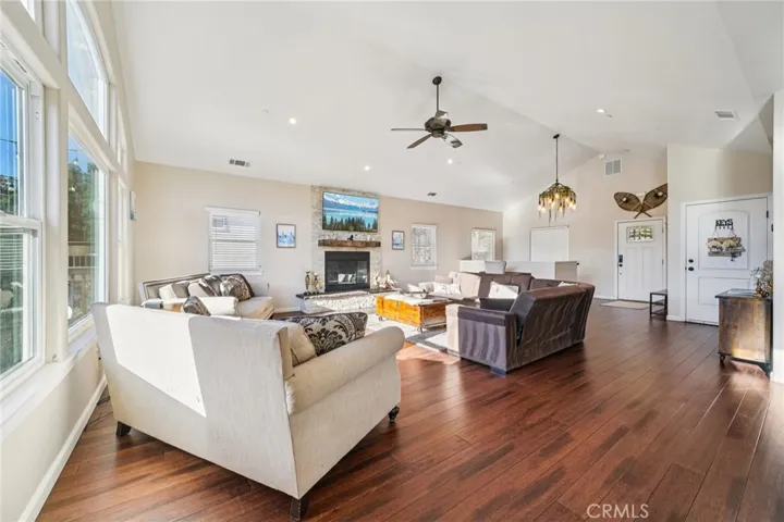 Bright, view-filled seating area flows seamlessly to the foyer and dining, enhancing circulation.