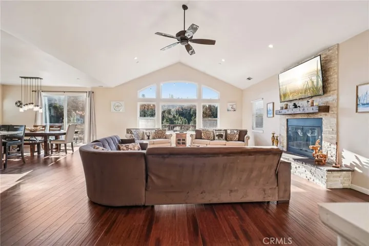 Wall of windows frames treetop views; clerestory arches amplify light and mountain ambience.