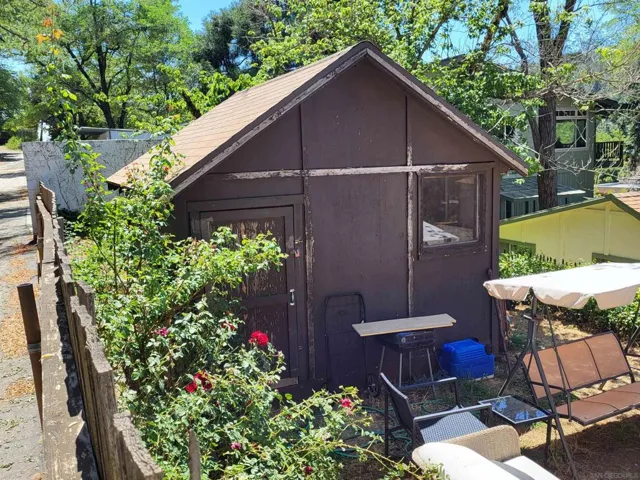 Shed in back yard of house.