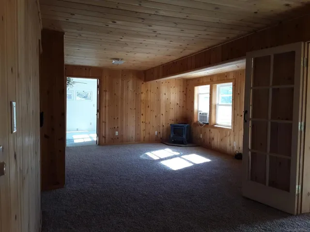 Living room with cute little propane heater.
