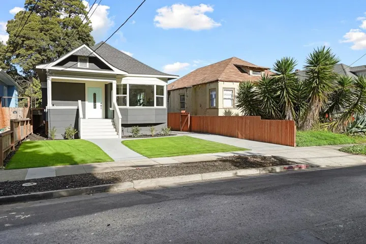 View of front of house with roof with shingles and a porch