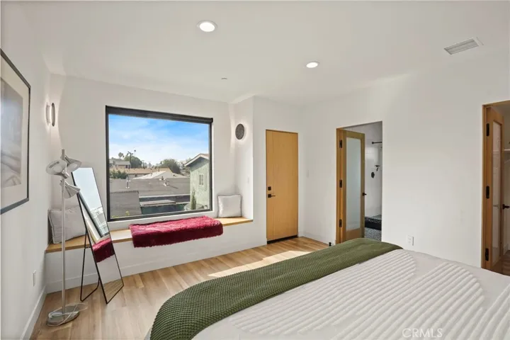 Primary suite with long built-in window bench