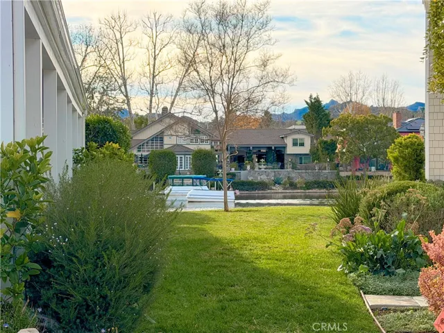 View of a boat floating on the lake from across the street
