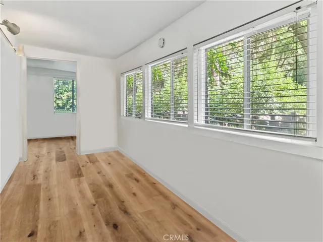 3rd bedroom. Laundry room is off 3rd bedroom. Open feel with lots of light. This room has it's own private entrance & bathroom.  Perfect for office? ADU? (AI removed furnishings in this pic).