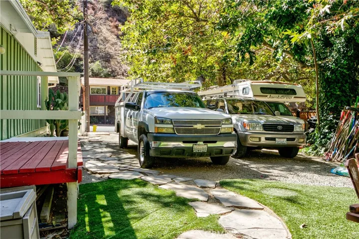 From back yard looking towards the front.  Love the deck off the 2nd bedroom - leading to parking & storage.