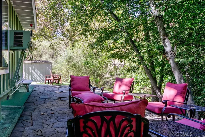 Back patio looking towards the storage & parking areas