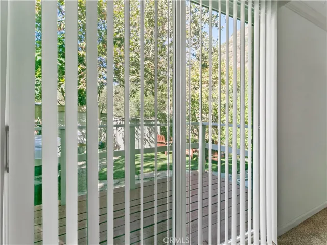 Door off 2nd bedroom leads to deck, parking and back yard.